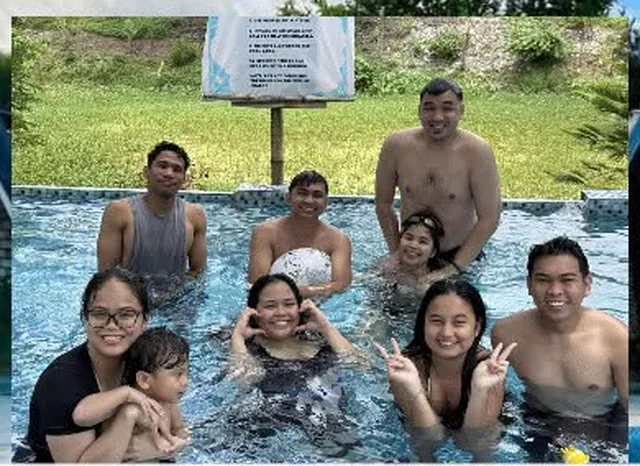 Guests in the pool on a bright afternoon