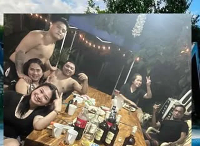 A group around the table late at night